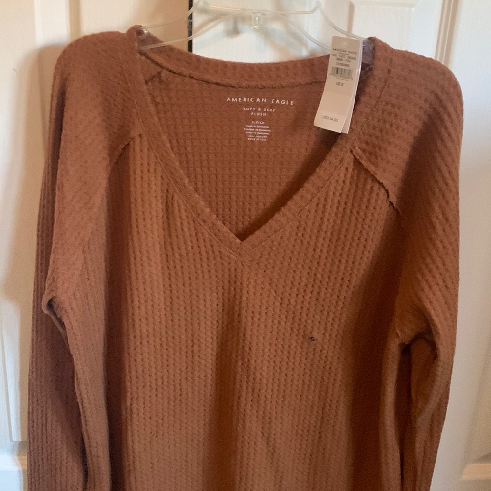 Pretty colored waffle knit. Slightly longer in back